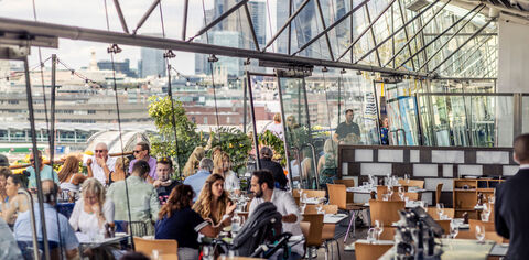 diners in the oxo tower restaurant view through windows