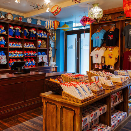 The interior of Mr Gruber's Shop at The Paddington Bear Experience at County Hall with t-shirts and toys on sale