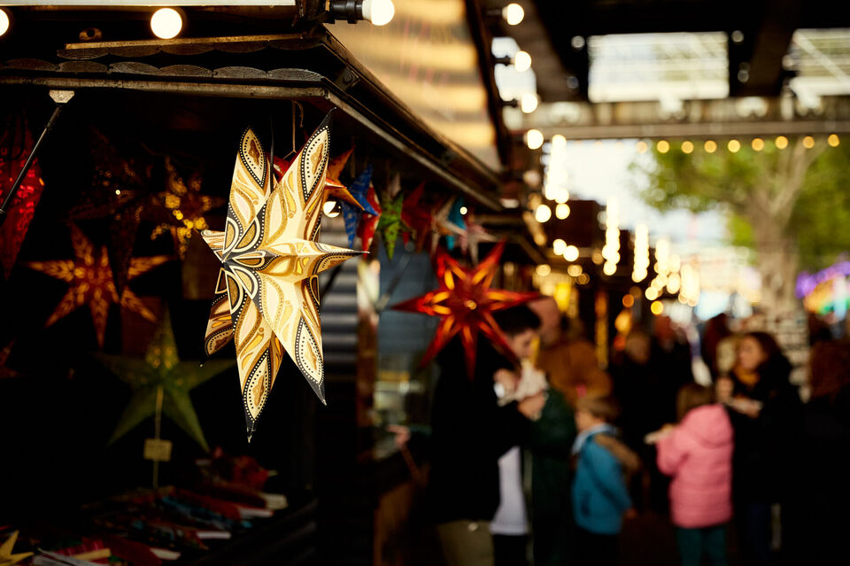 Festive lights at a Christmas market stall in South Bank