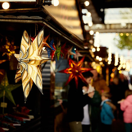 Festive lights at a Christmas market stall in South Bank